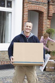 Moving crew preparing items safely with protective equipment in Tootingbec