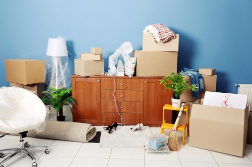 Boxes and furniture being loaded into a van near South West London homes