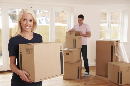 Local movers unpacking boxes in a Tooting Bec property