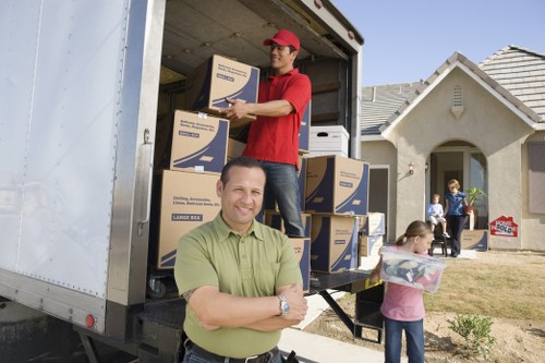 Packed office furniture and IT equipment prepared for relocation