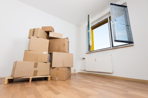 Packed moving boxes ready for transport in a Tooting Bec flat