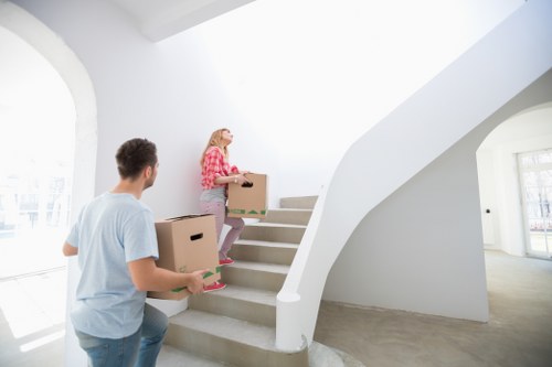 Loading furniture and boxes into a moving truck in Tooting Bec