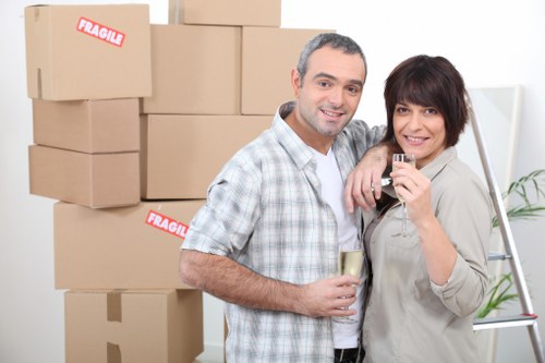 Movers carrying furniture from a Tooting Bec home